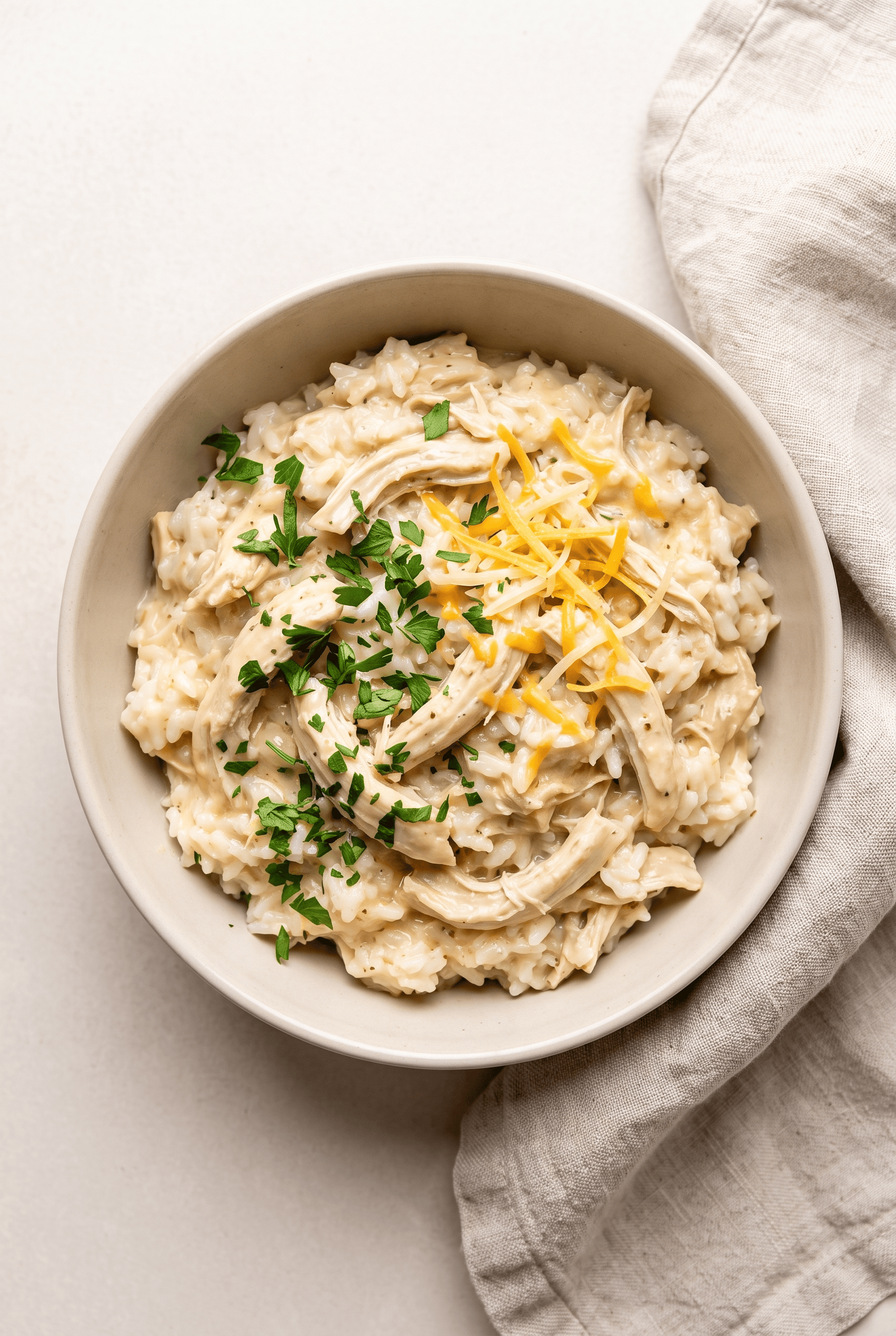Overhead view of creamy crockpot chicken and rice